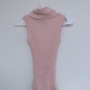 Pink turtleneck bodysuit